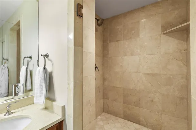 a bathroom with a sink and shower