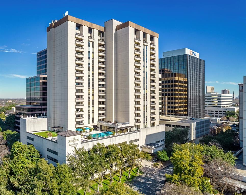 5909 Luther Lane, Unit 1102 Dallas, TX 75225 - Photo 26 of 31 a view of a building with a outdoor space