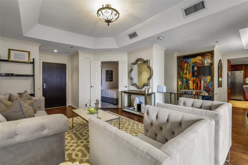 5909 Luther Lane, Unit 1102 Dallas, TX 75225 - Photo 3 of 31 a living room with furniture and a wooden floor