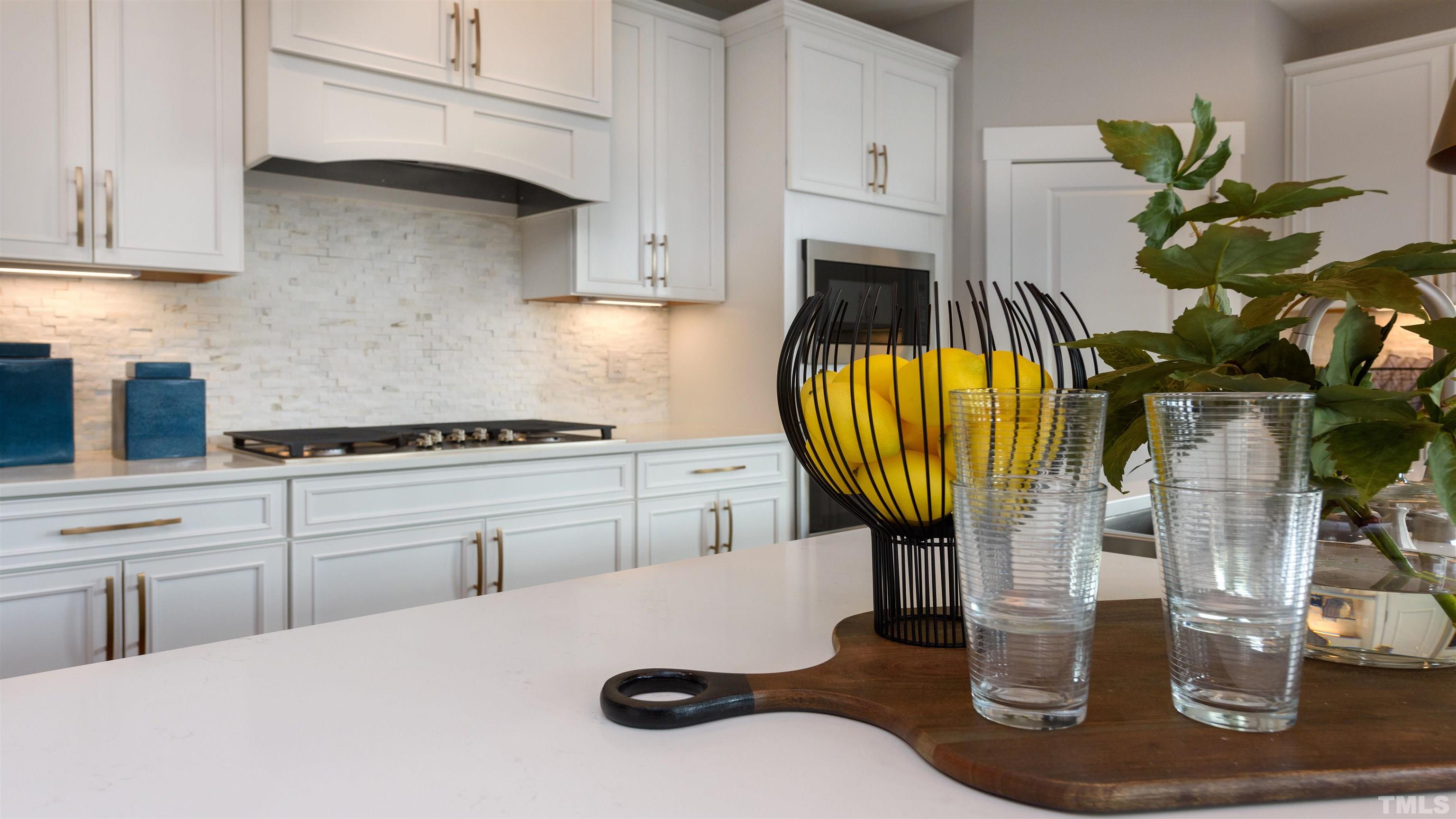 3245 Lynn Road, Unit 20 Raleigh, NC 27613 - Photo 22 of 26 a kitchen with a sink a stove and a white cabinets