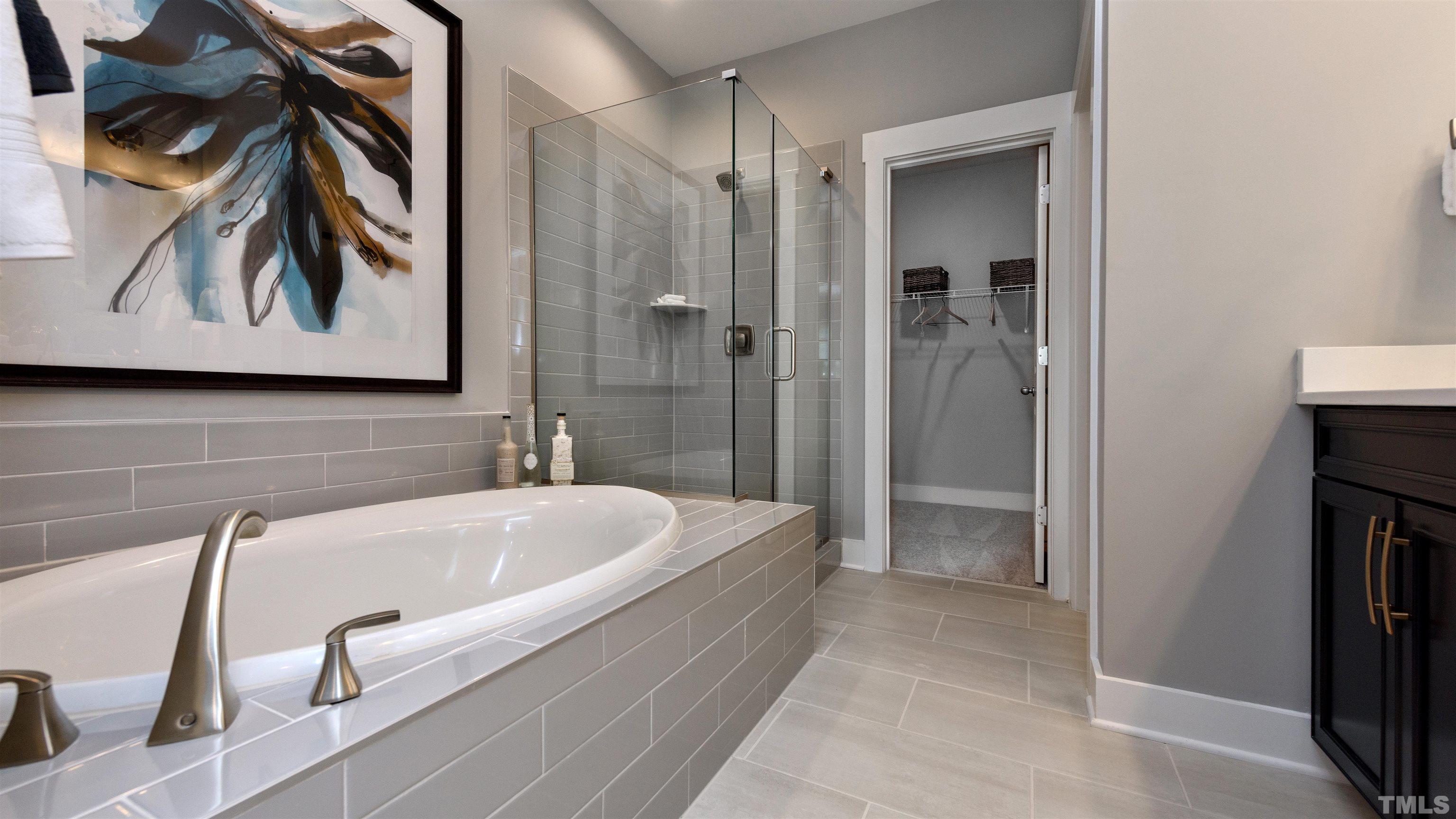 3245 Lynn Road, Unit 20 Raleigh, NC 27613 - Photo 25 of 26 a bathroom with a tub and a shower