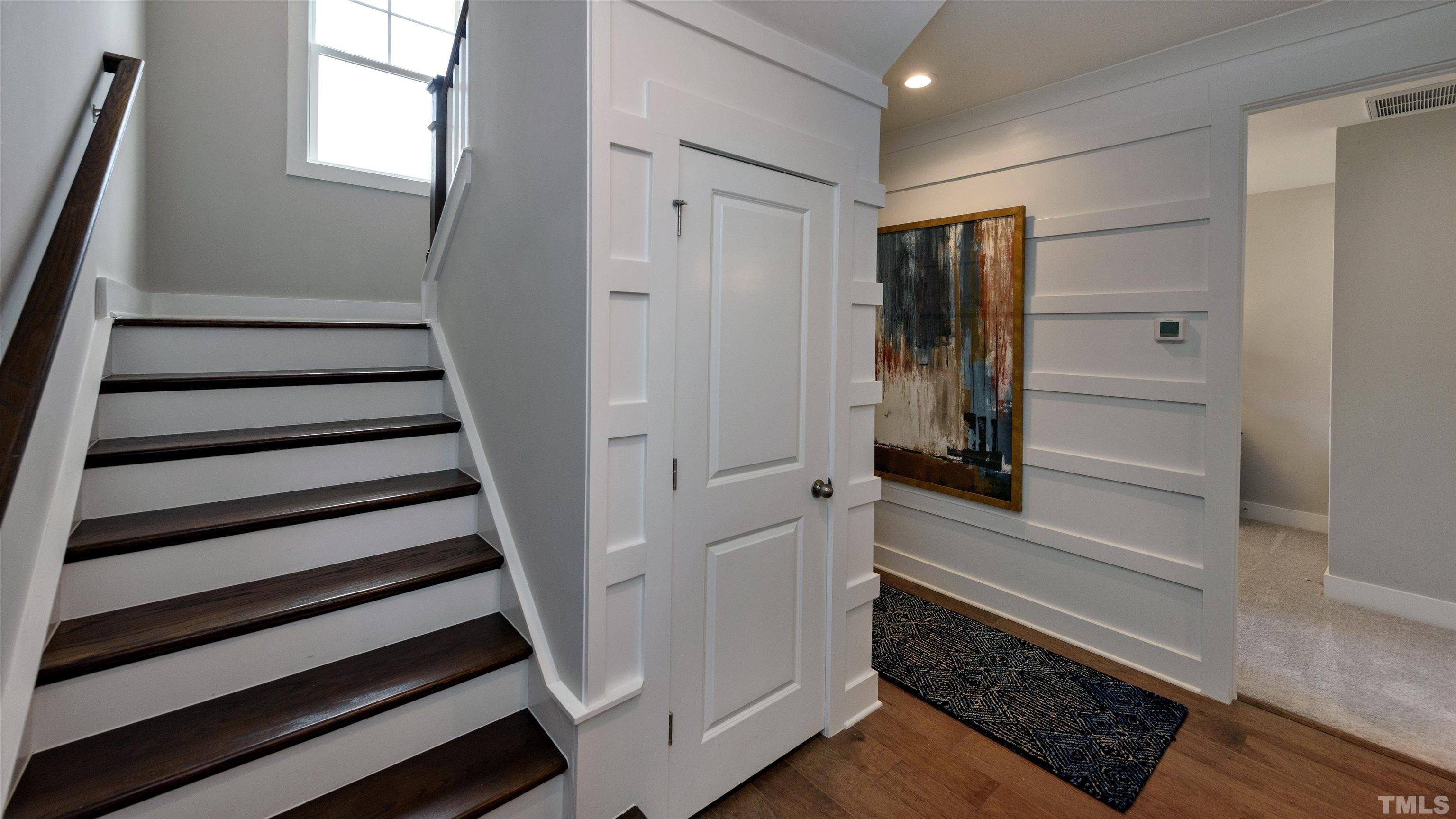 3245 Lynn Road, Unit 20 Raleigh, NC 27613 - Photo 8 of 26 a view of entryway with stairs and wooden floor