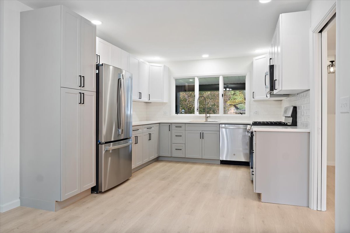 5 Ridgemont Road Normal, IL 61761 - Photo 17 of 58 a kitchen with a refrigerator sink and cabinets