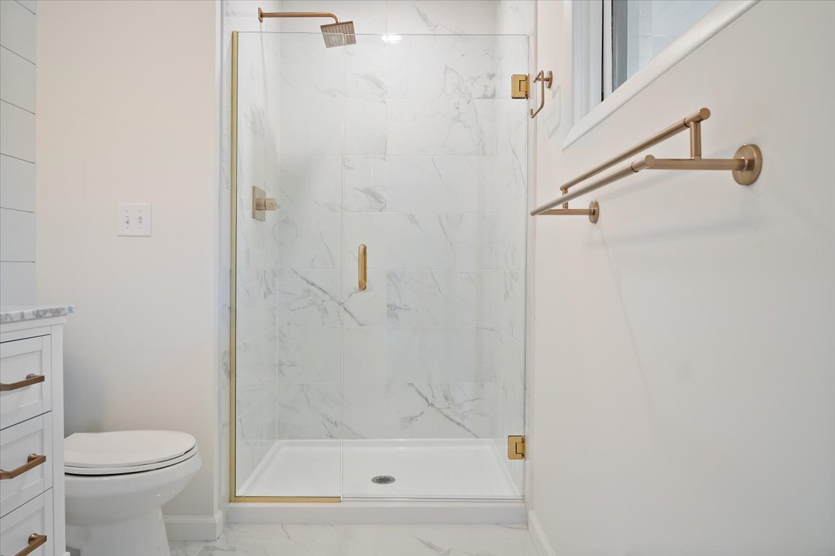 5 Ridgemont Road Normal, IL 61761 - Photo 30 of 58 a bathroom with a shower a toilet and a sink