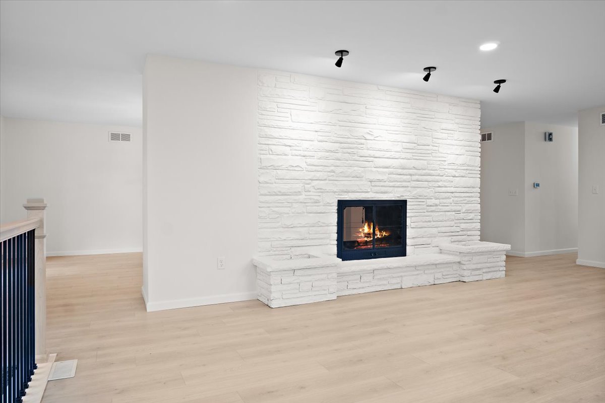 5 Ridgemont Road Normal, IL 61761 - Photo 10 of 58 a view of an empty room with a fireplace