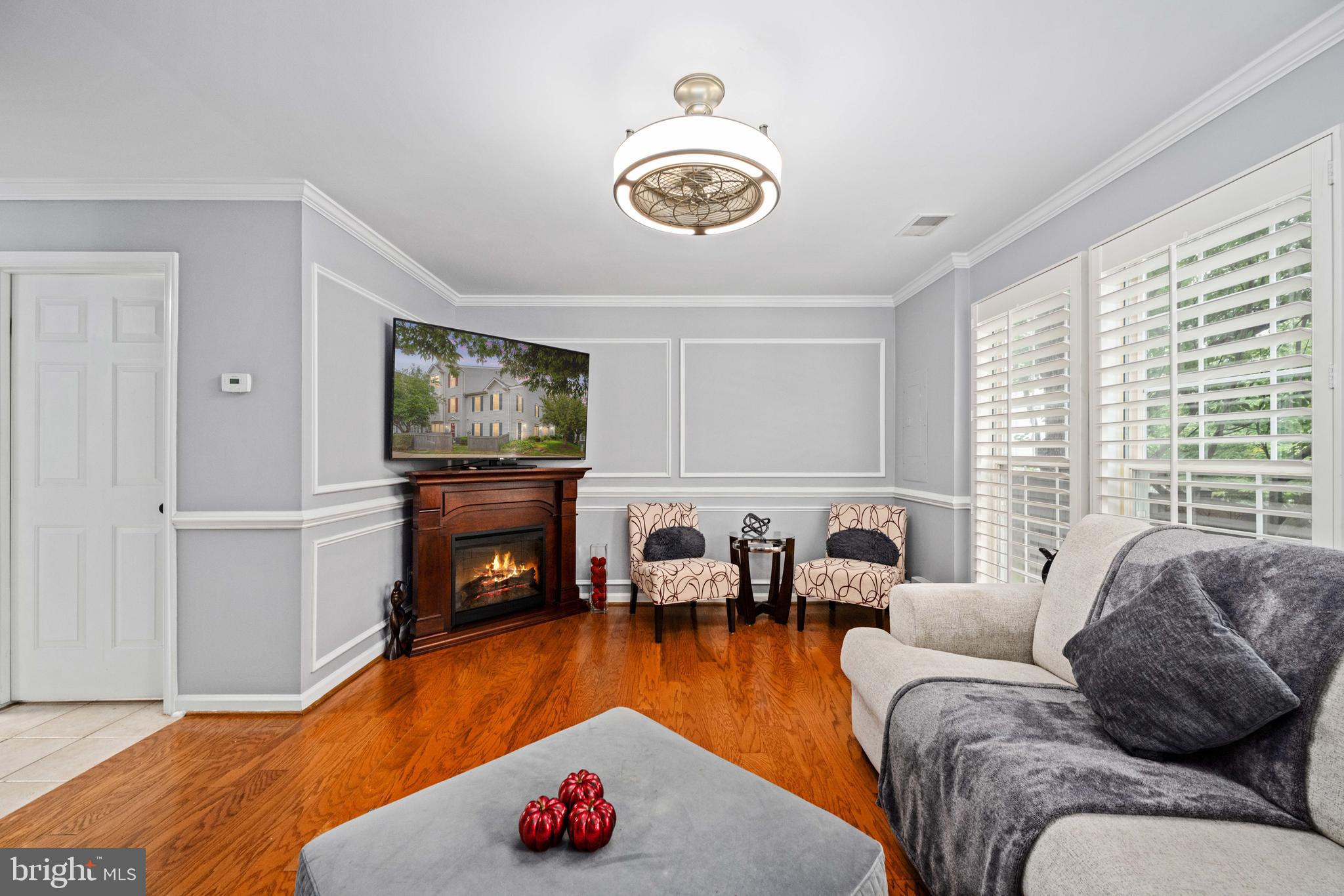 9332 Wax Myrtle Way Manassas, VA 20110 - Photo 18 of 50 a living room with furniture and a fireplace