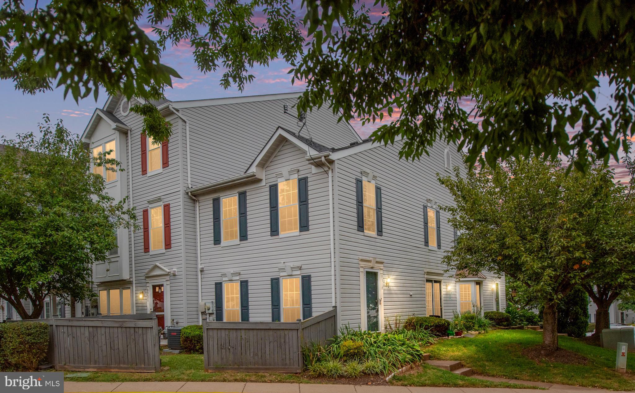 9332 Wax Myrtle Way Manassas, VA 20110 - Photo 2 of 50 a front view of a house with garden