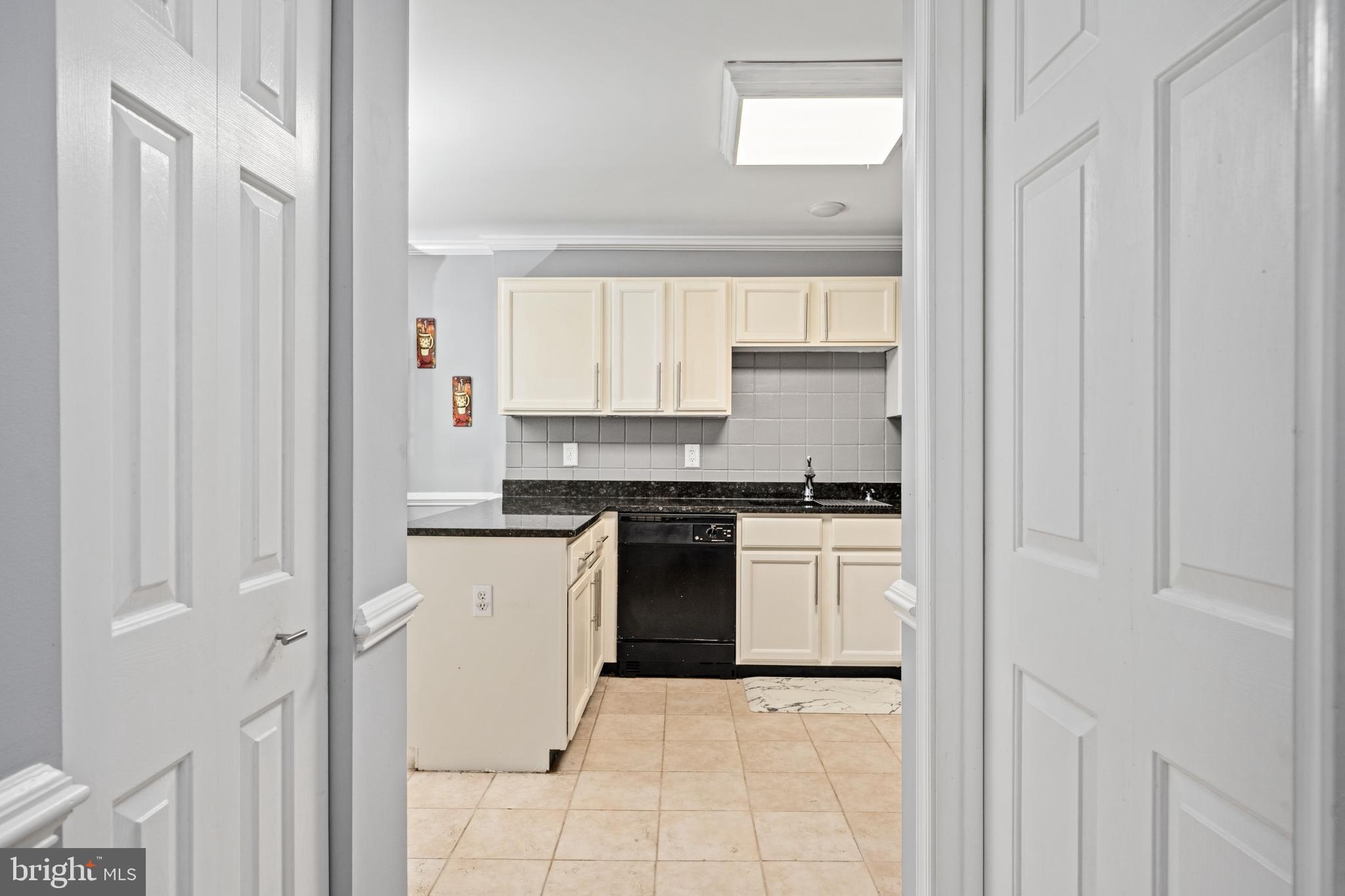 9332 Wax Myrtle Way Manassas, VA 20110 - Photo 21 of 50 a kitchen with stainless steel appliances granite countertop white cabinets and window