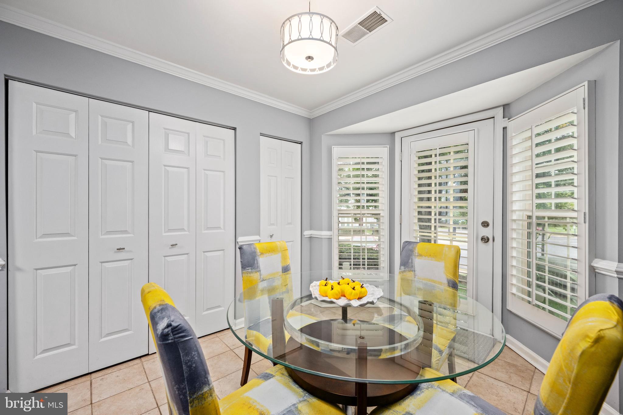 9332 Wax Myrtle Way Manassas, VA 20110 - Photo 29 of 50 a view of a dining room with furniture a chandelier and wooden floor