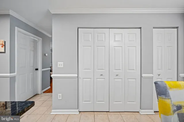 a view of a kitchen with wooden cabinets