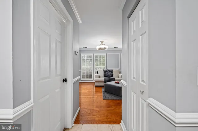a living room with furniture window and wooden floor