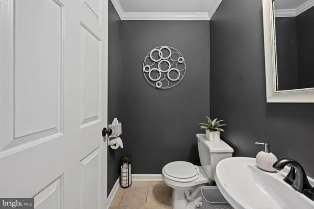 a bathroom with a toilet and a sink