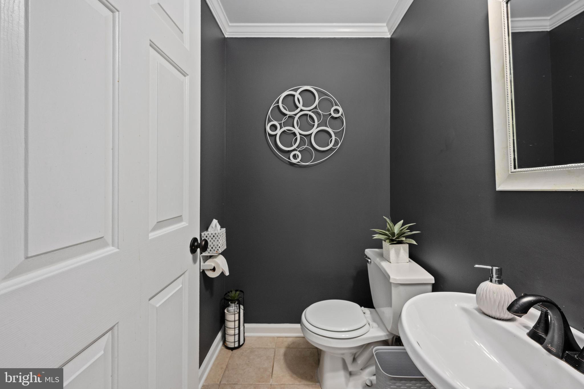 9332 Wax Myrtle Way Manassas, VA 20110 - Photo 33 of 50 a bathroom with a toilet and a sink