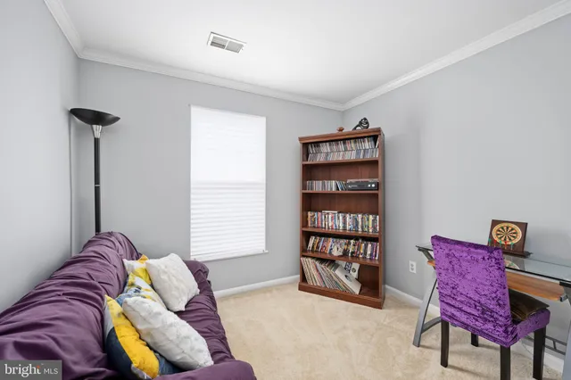 a bedroom with a bed and a book shelf