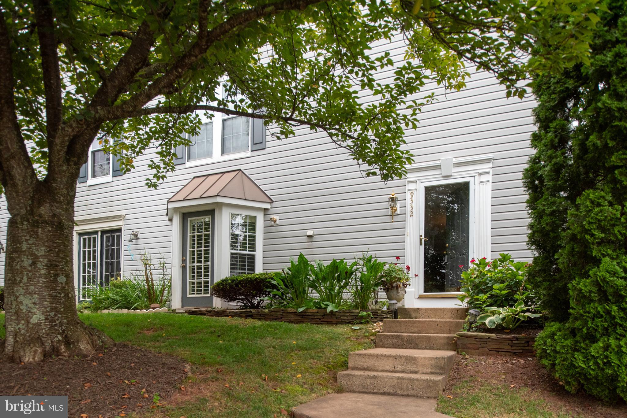 9332 Wax Myrtle Way Manassas, VA 20110 - Photo 4 of 50 a front view of a house with a yard