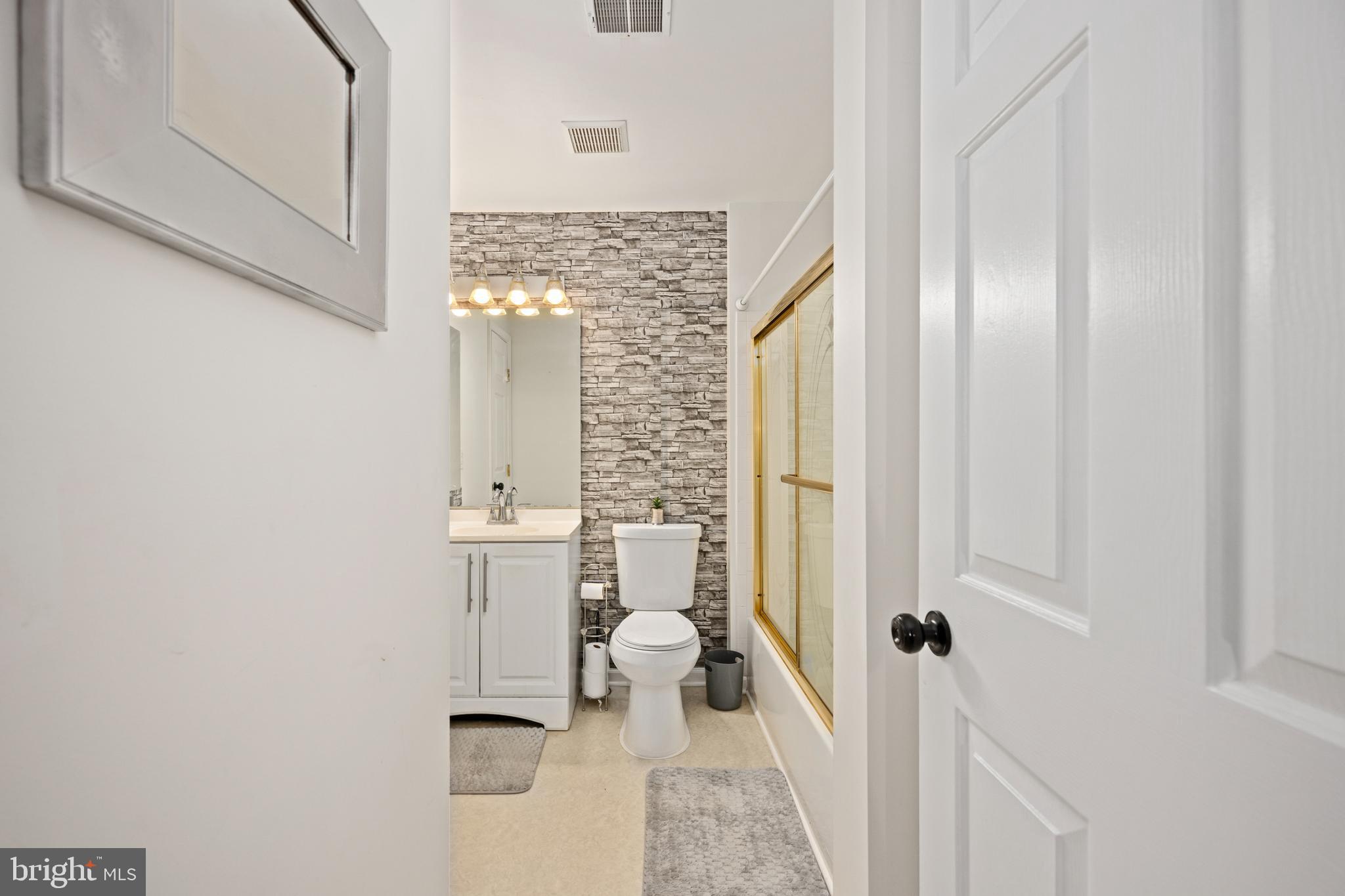 9332 Wax Myrtle Way Manassas, VA 20110 - Photo 41 of 50 a bathroom with a sink and mirror