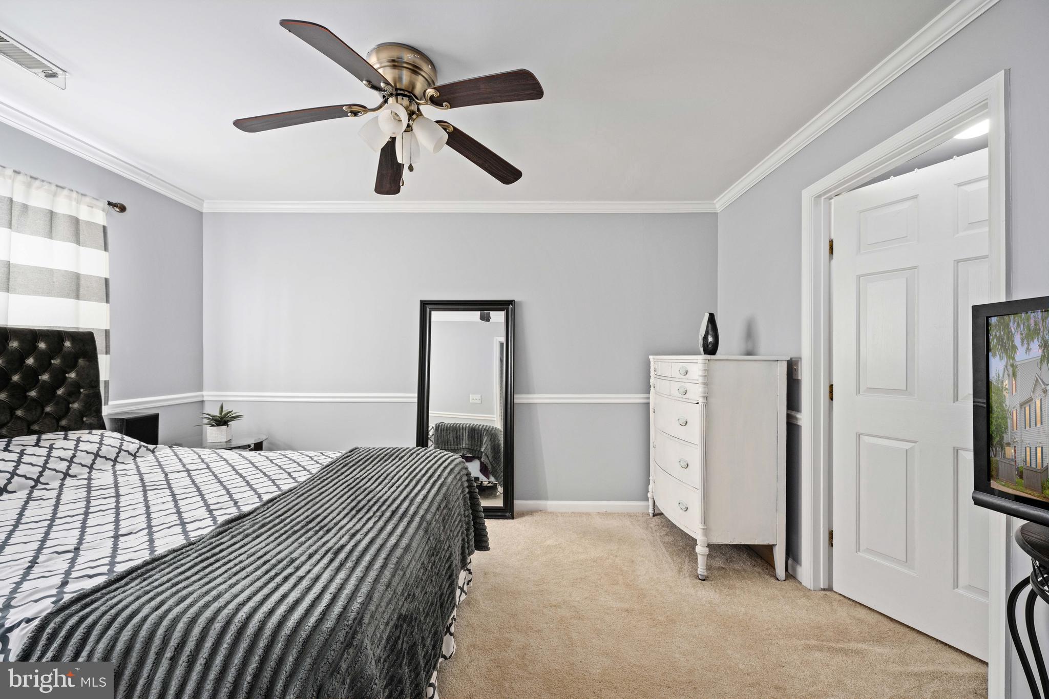 9332 Wax Myrtle Way Manassas, VA 20110 - Photo 44 of 50 a bedroom with a bed and a refrigerator