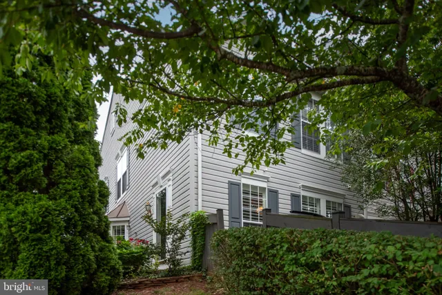a view of a house with a tree