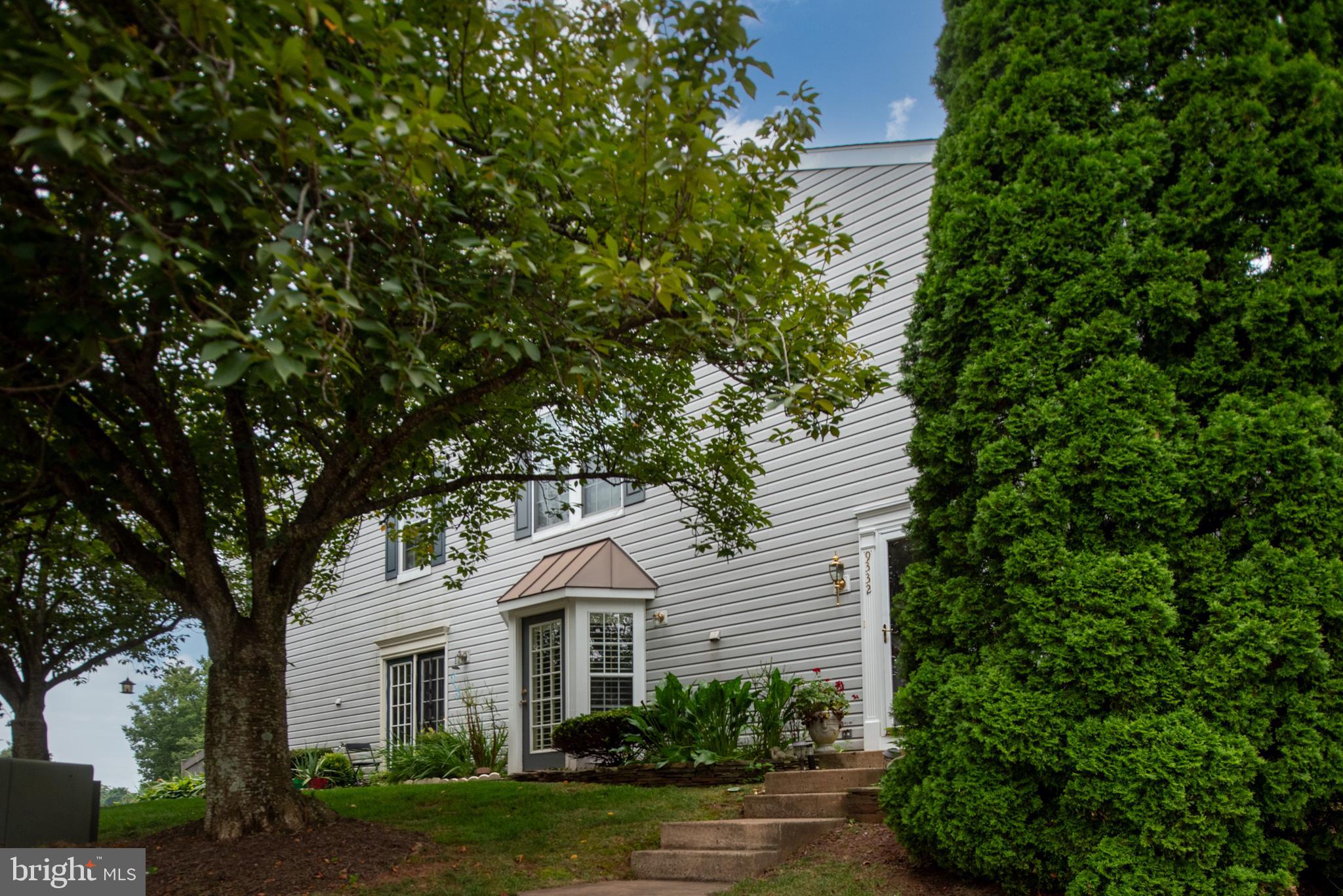 9332 Wax Myrtle Way Manassas, VA 20110 - Photo 10 of 50 a front view of a house with a yard and green space