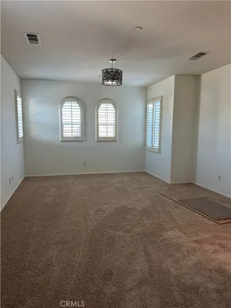 en empty room with windows