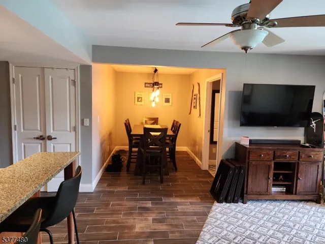 a view of a livingroom with furniture window and wooden floor