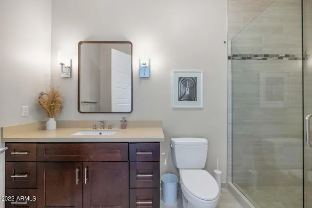 a view of a patio with a table and chairs under an umbrella