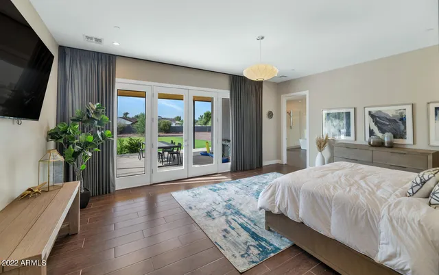 a bathroom with a double vanity sink toilet and shower