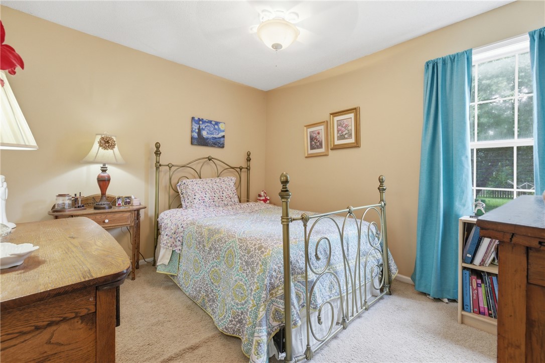 128 Kelly Lane Easley, SC 29642 - Photo 20 of 23 Well-lit sleeping quarters with plush carpeting and a bright window offering peaceful views.