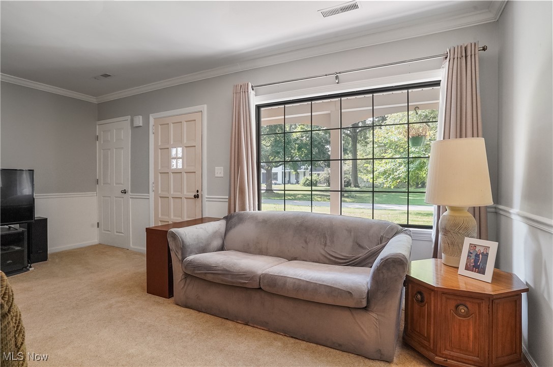 2829 Lee Road Silver Lake, OH 44224 - Photo 5 of 30 Carpeted living room with ornamental molding