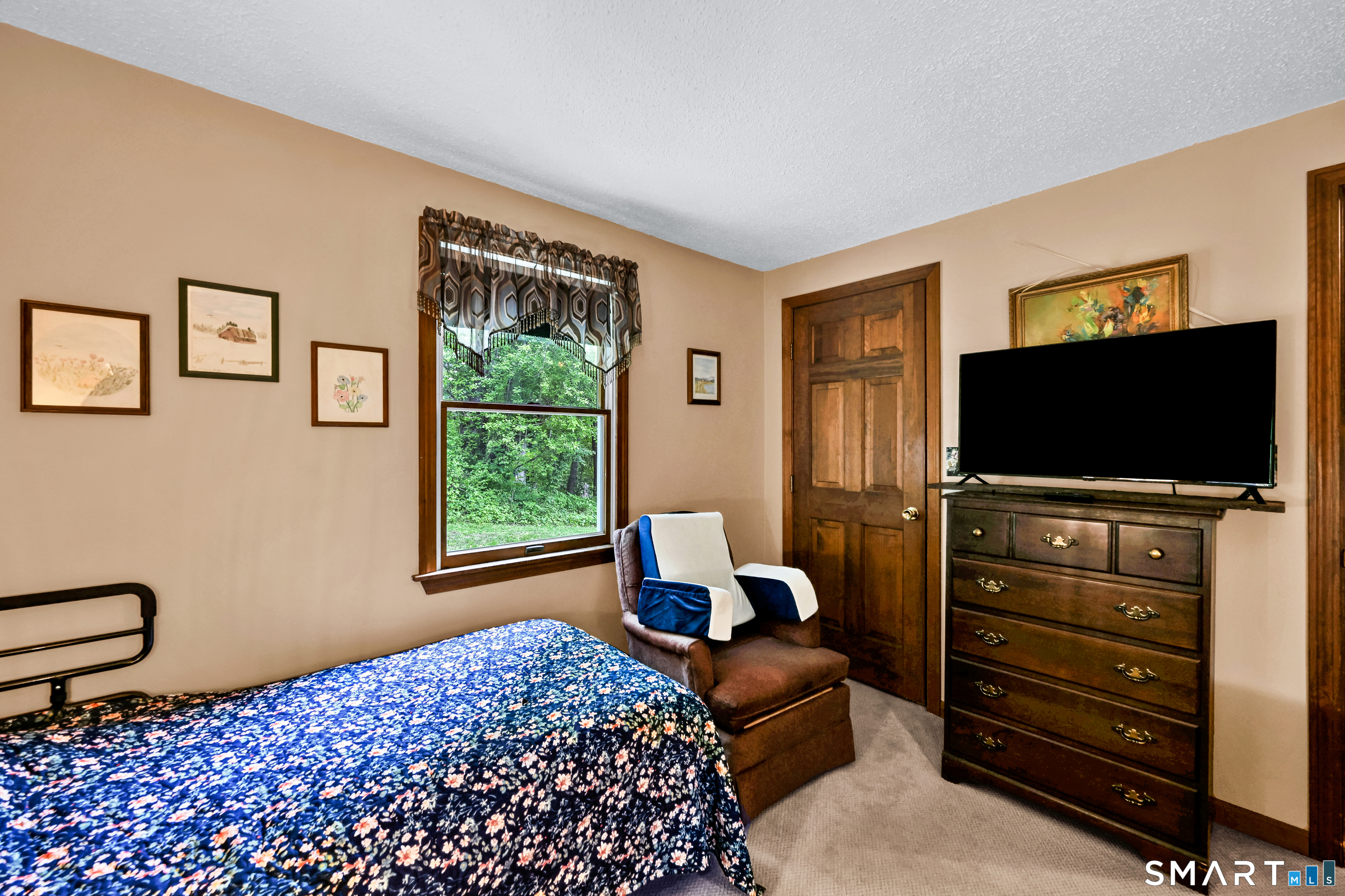 155 Lake Harwinton Road Harwinton, CT 06791 - Photo 31 of 39 a bedroom with a bed and a flat screen tv