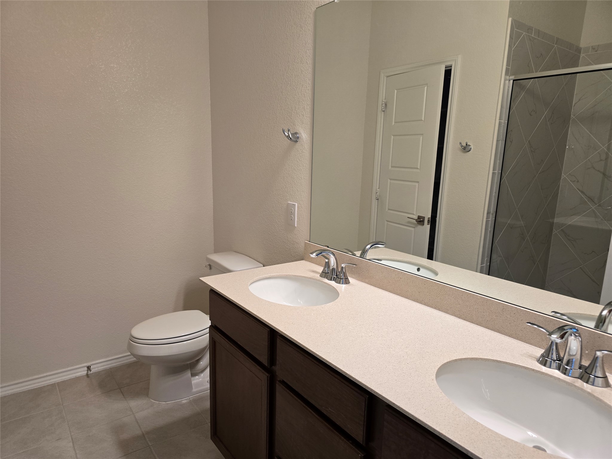 210 Summit Drive Lockhart, TX 78644 - Photo 12 of 21 a bathroom with a sink toilet and a mirror