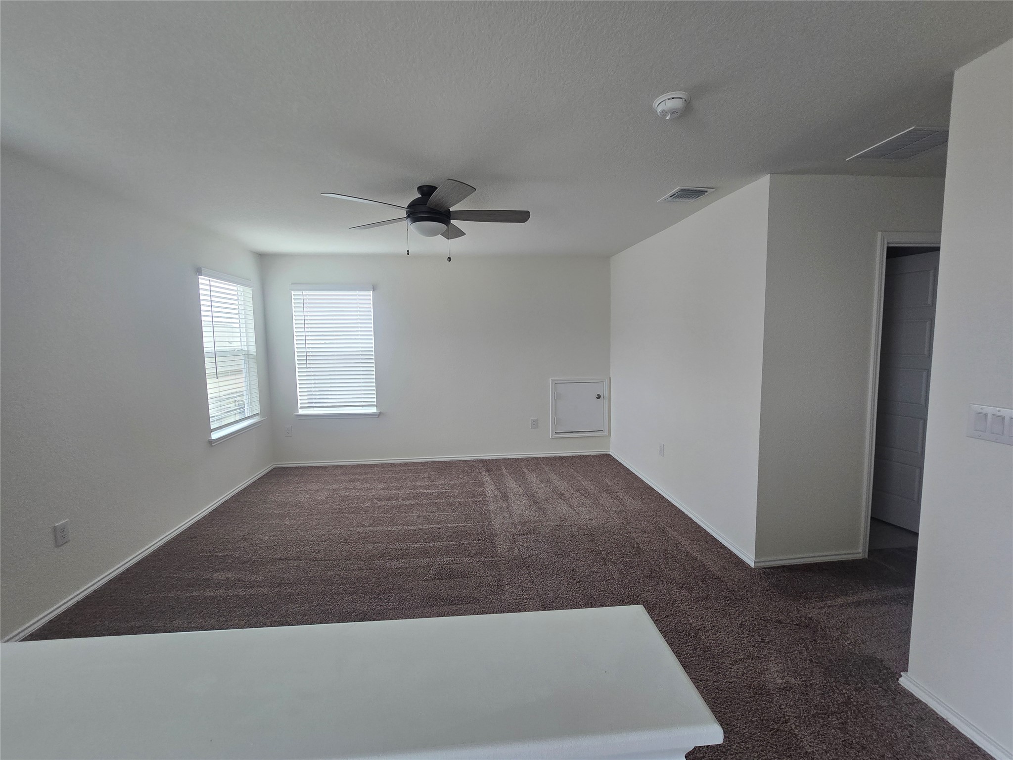 210 Summit Drive Lockhart, TX 78644 - Photo 14 of 21 wooden floor in an empty room with a window