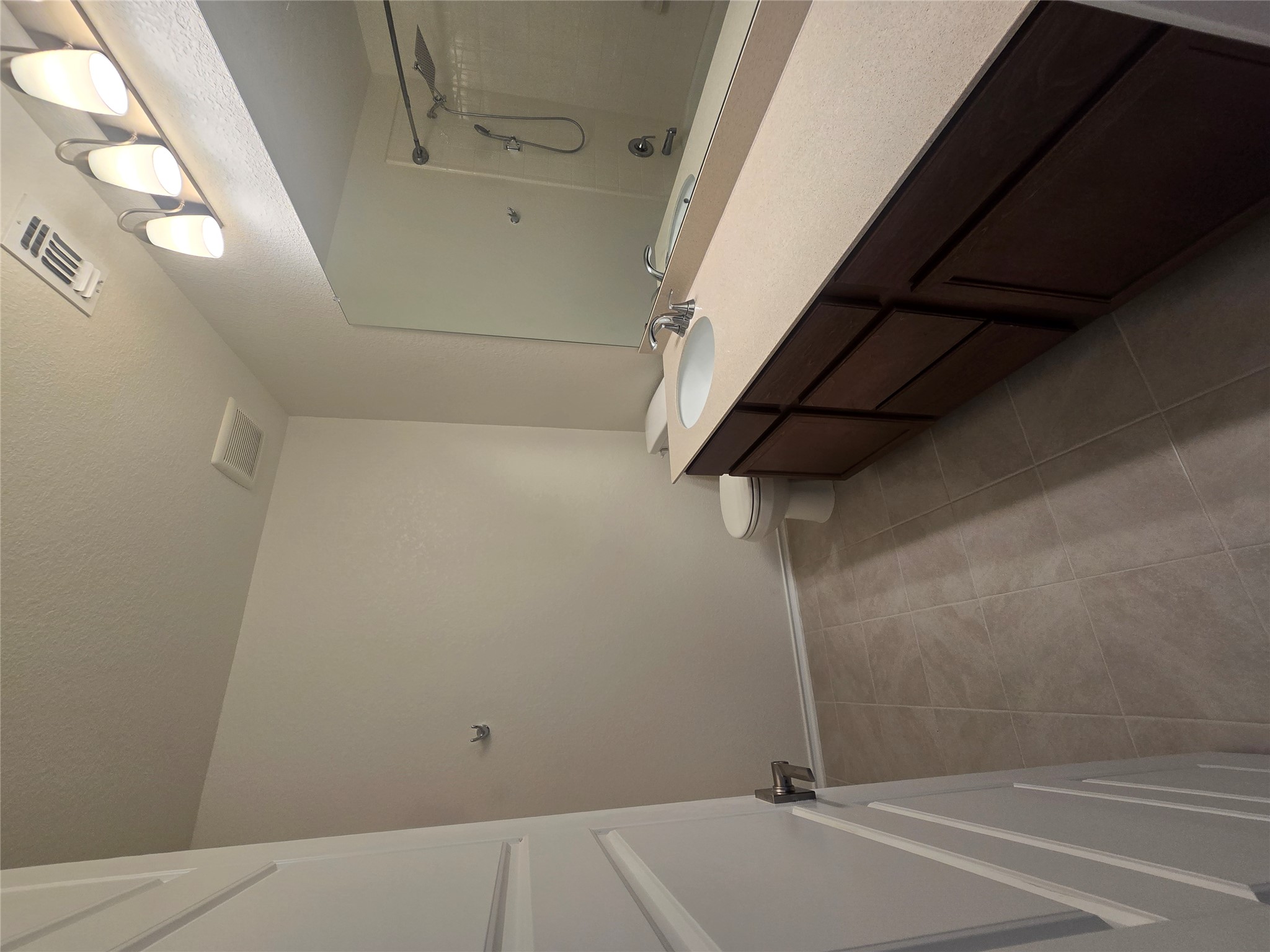 210 Summit Drive Lockhart, TX 78644 - Photo 16 of 21 a bathroom with a sink and a mirror