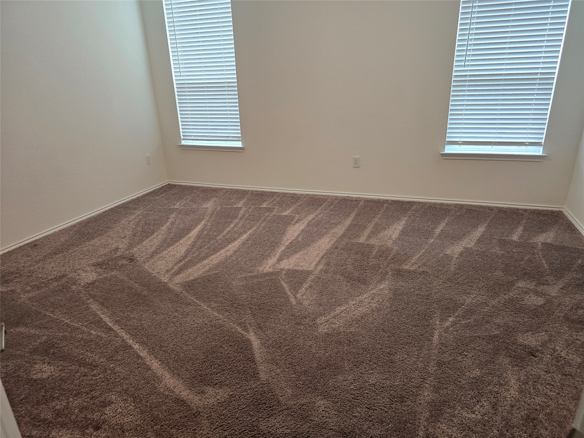210 Summit Drive Lockhart, TX 78644 - Photo 17 of 21 an empty room with a window