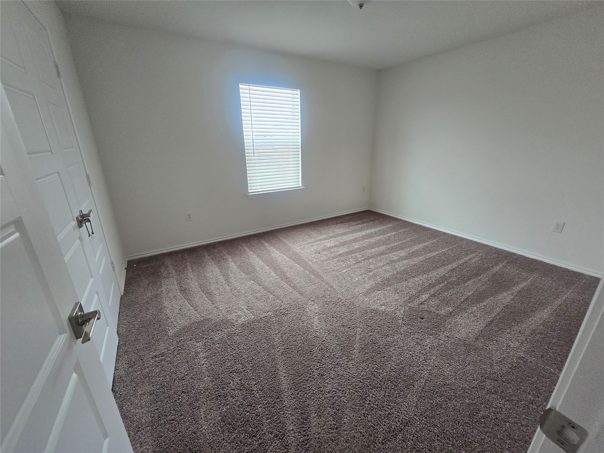 210 Summit Drive Lockhart, TX 78644 - Photo 18 of 21 an empty room with windows