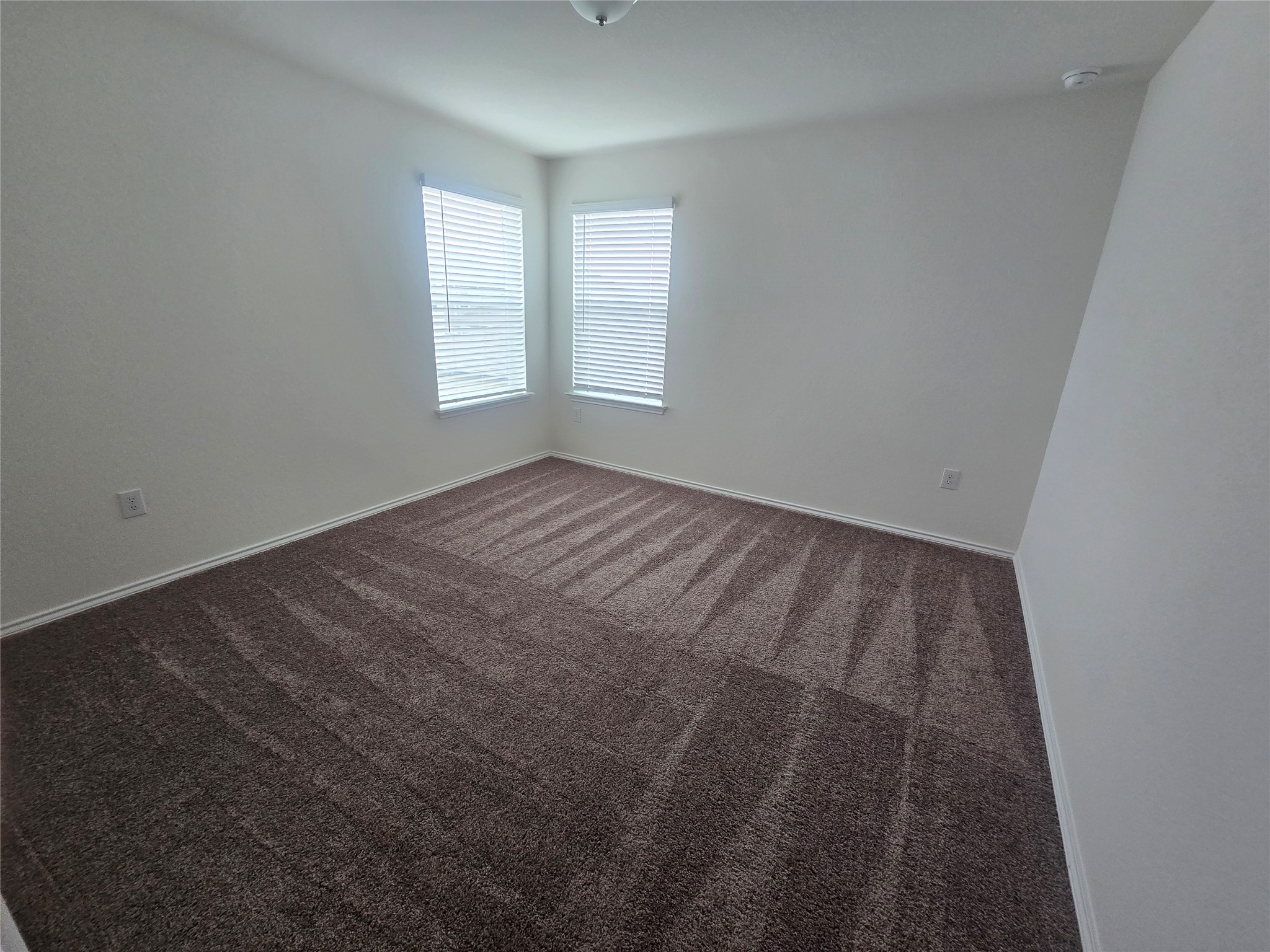 210 Summit Drive Lockhart, TX 78644 - Photo 20 of 21 an empty room with windows