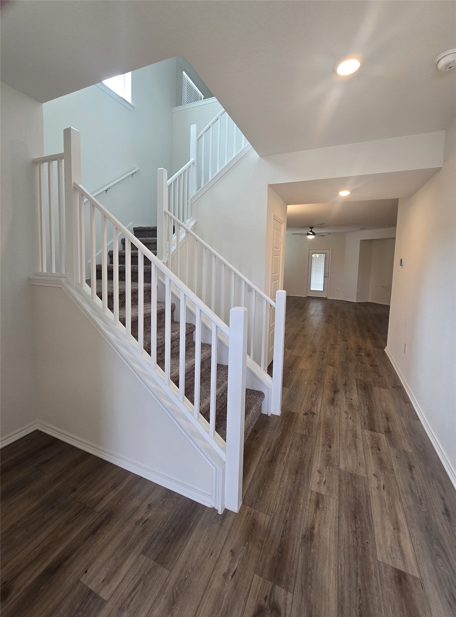 210 Summit Drive Lockhart, TX 78644 - Photo 3 of 21 a view of a hallway with wooden floor