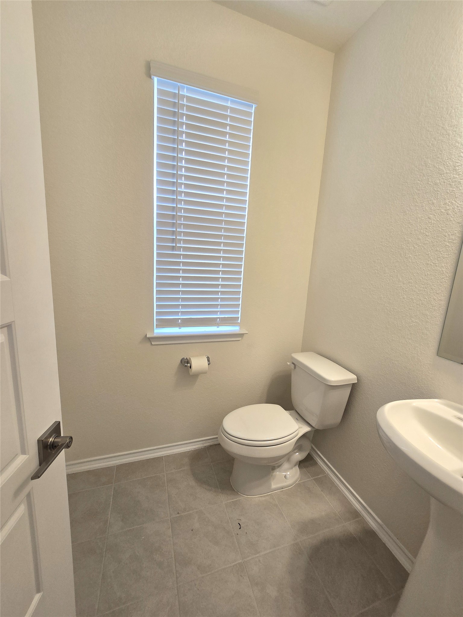 210 Summit Drive Lockhart, TX 78644 - Photo 4 of 21 a white toilet sitting next to a bathroom sink
