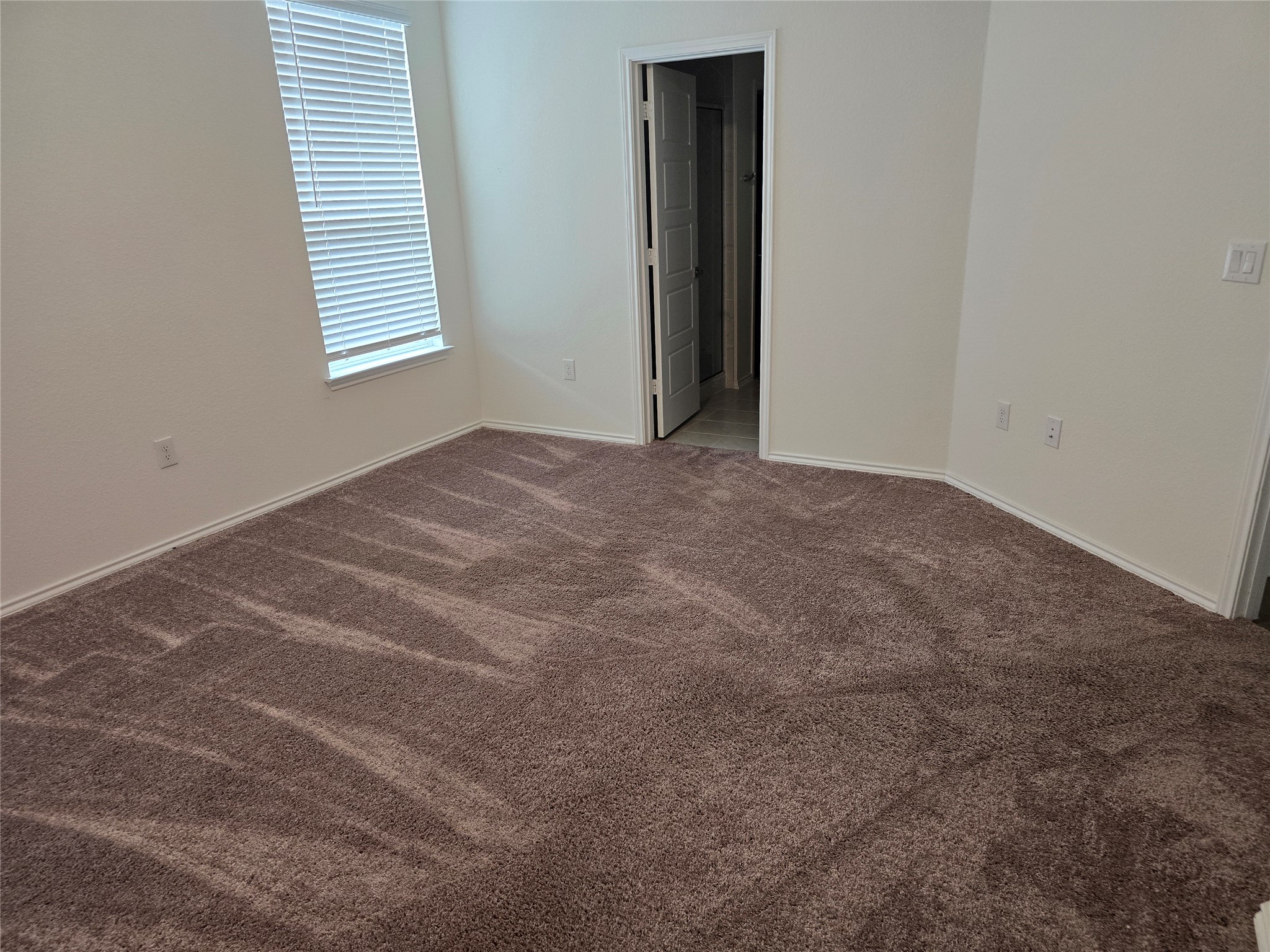 210 Summit Drive Lockhart, TX 78644 - Photo 10 of 21 an empty room with windows