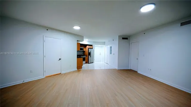 a view of an empty room with a window