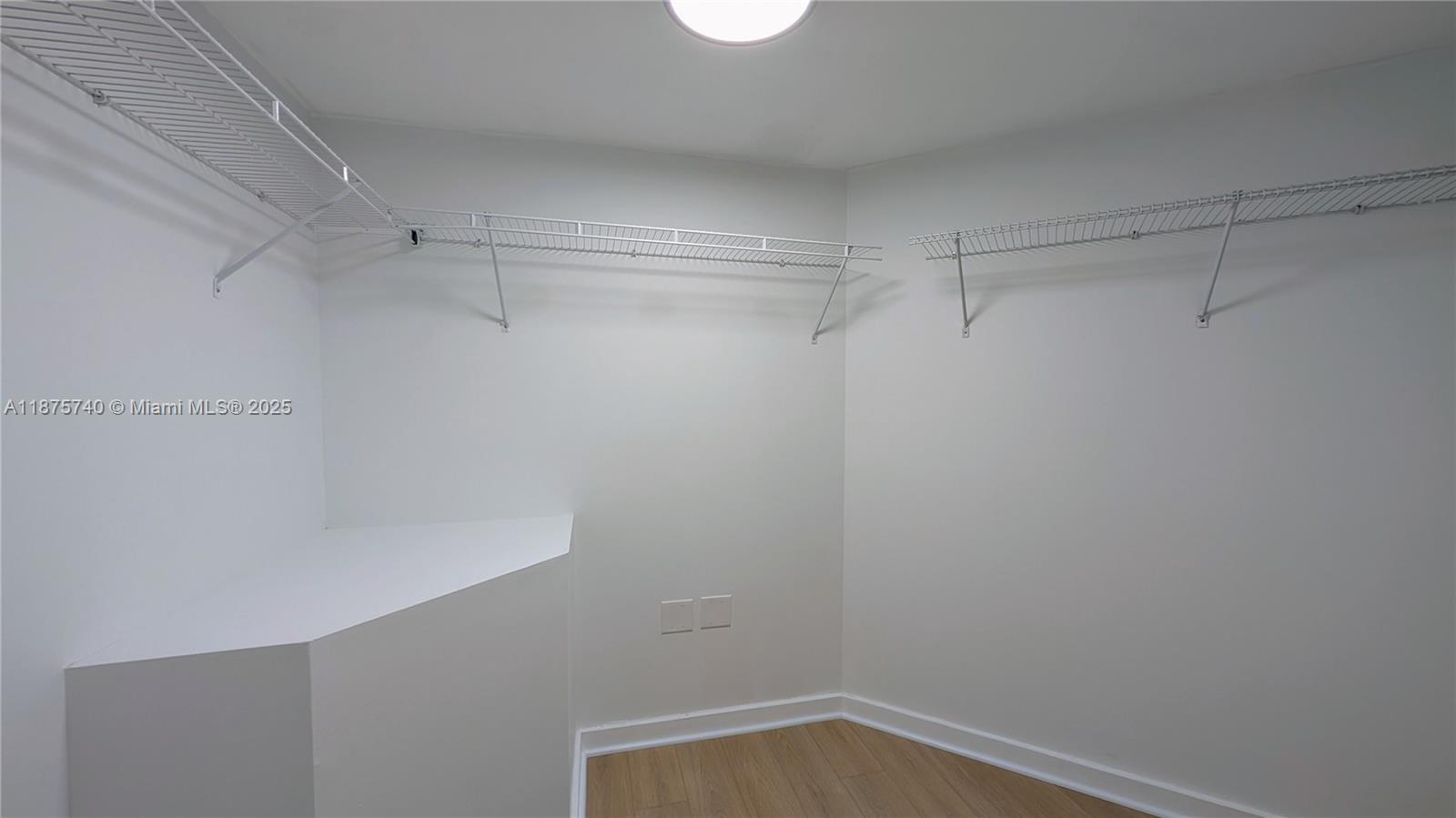 350 South Miami Avenue, Unit 1901 Miami, FL 33130 - Photo 29 of 81 a view of a room with racks on the wall