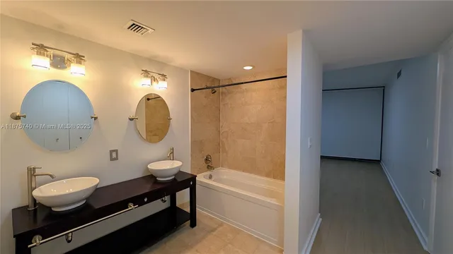 a bathroom with a mirror and a shower curtain