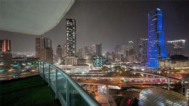 a large kitchen with stainless steel appliances granite countertop a refrigerator and a stove top oven