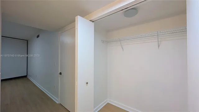 a bathroom with a granite countertop sink mirror and vanity