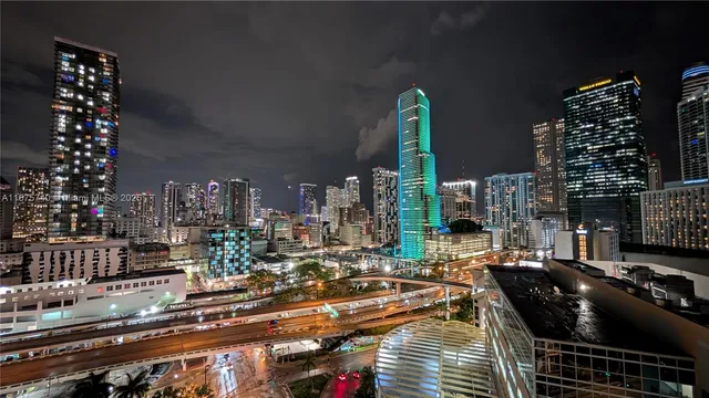 a bedroom with furniture and a flat screen tv