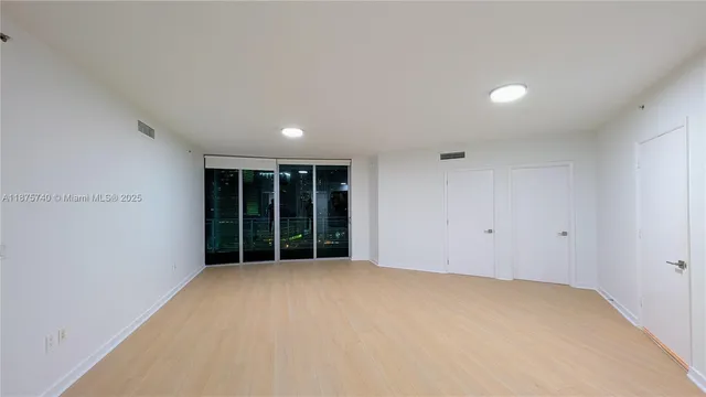 a kitchen with a sink and a refrigerator