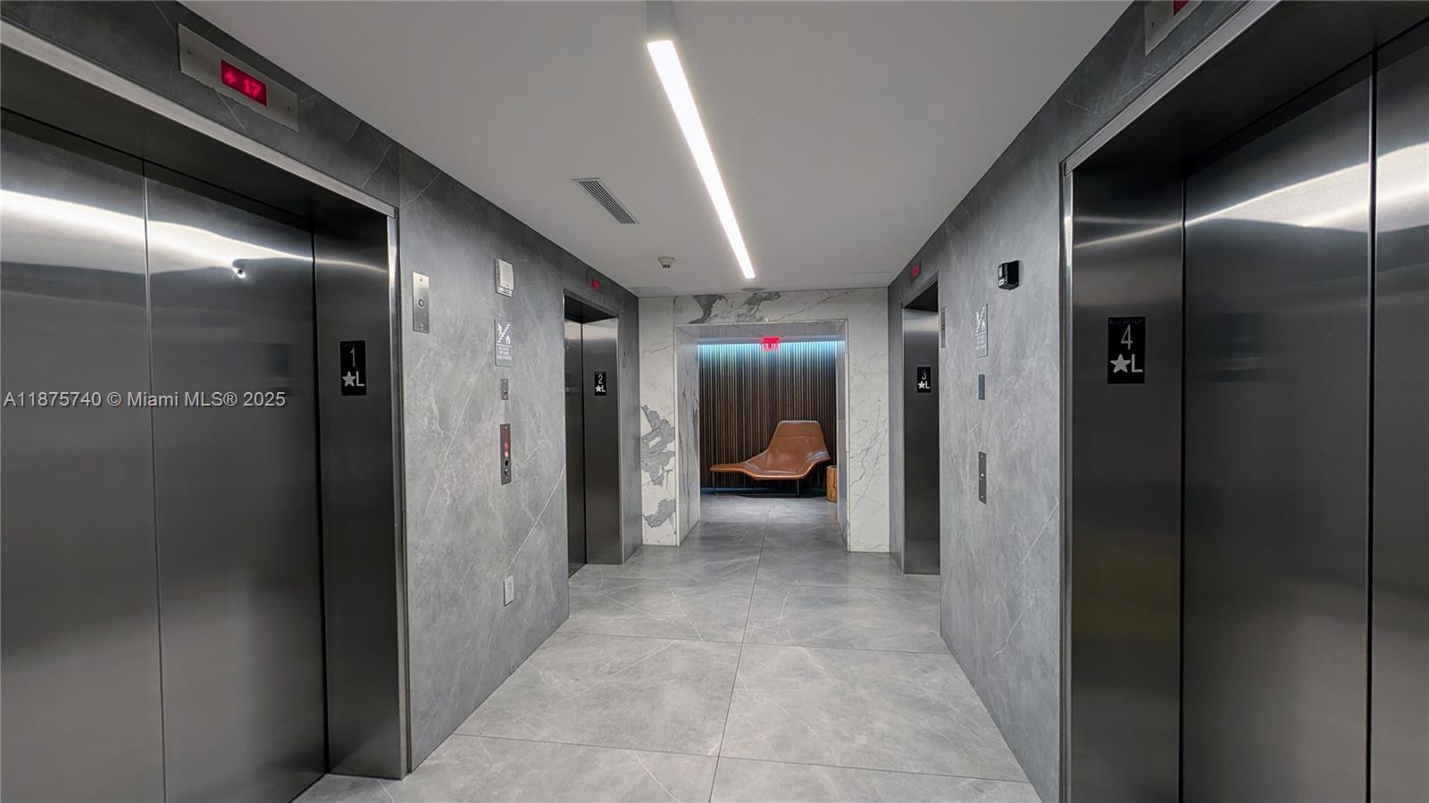 350 South Miami Avenue, Unit 1901 Miami, FL 33130 - Photo 62 of 81 a view of a hallway with a livingroom and a bathroom