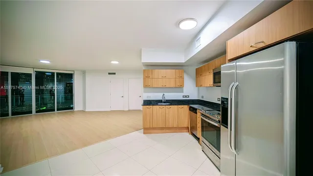 a view of an empty room with a window