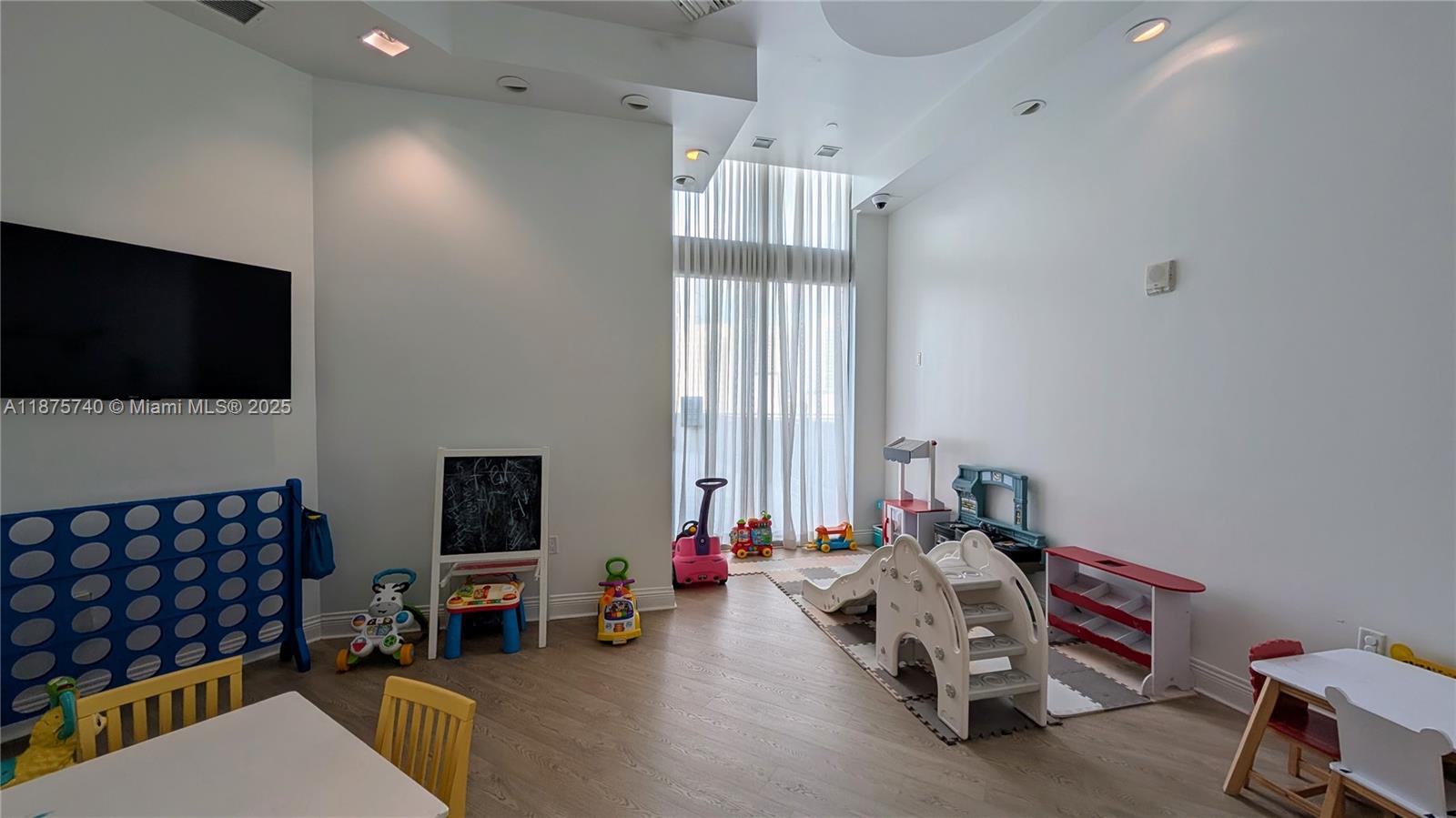 350 South Miami Avenue, Unit 1901 Miami, FL 33130 - Photo 73 of 81 a bedroom with furniture and a flat screen tv