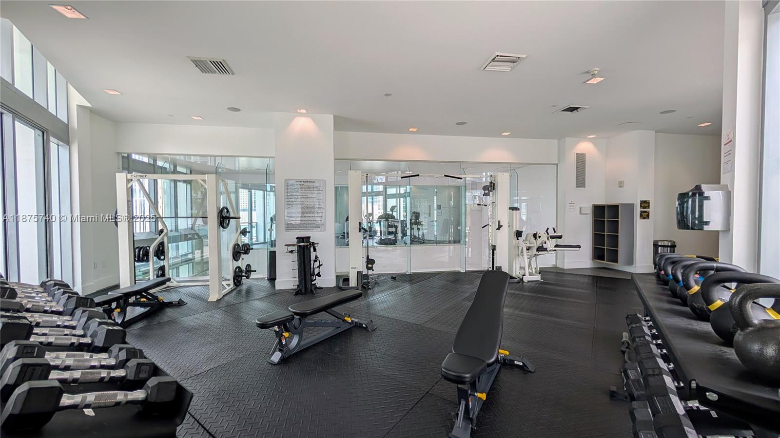 350 South Miami Avenue, Unit 1901 Miami, FL 33130 - Photo 78 of 81 a room with gym equipment and a large window